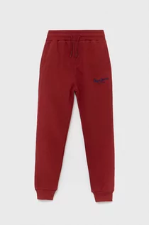 Spodnie i spodenki dla chłopców - Pepe Jeans spodnie dresowe bawełniane dziecięce Lamonty kolor czerwony z aplikacją - grafika 1