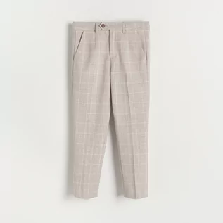 Spodnie i spodenki dla chłopców - Reserved - Garniturowe spodnie w kratę - Beżowy - grafika 1