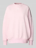 Bluzy damskie - Bluza o kroju oversized z nadrukiem z logo - miniaturka - grafika 1