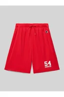 Spodnie sportowe damskie - Szorty z dzianiny dresowej o kroju regular fit z nadrukiem z logo - Champion - miniaturka - grafika 1