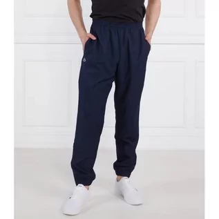 Dresy męskie - Lacoste Spodnie dresowe | Relaxed fit - grafika 1