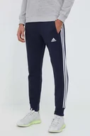 Spodnie męskie - adidas spodnie dresowe bawełniane kolor granatowy z aplikacją - miniaturka - grafika 1