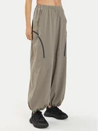 Spodnie sportowe damskie - Under Armour Spodnie dresowe Ua Unstoppable Airvent Parachute Pant 1382740-200 Szary Loose Fit - miniaturka - grafika 1