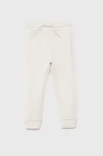 Spodnie damskie - Guess Spodnie dziecięce kolor biały gładkie - grafika 1