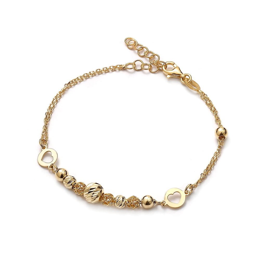 Srebrna bransoletka pozłacana z zawieszkami w kształcie kulek oraz serduszek