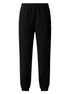 Spodnie sportowe damskie - The North Face Spodnie dresowe Glacier NF0A8DQR Czarny Regular Fit - miniaturka - grafika 1