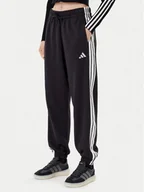 Spodnie sportowe damskie - adidas Spodnie dresowe Essentials 3-Stripes Fleece JE1276 Czarny Loose Fit - miniaturka - grafika 1