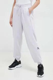 Spodnie damskie - Puma spodnie dresowe kolor fioletowy z nadrukiem - grafika 1