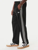 Spodnie sportowe męskie - adidas Spodnie dresowe Firebird KD8315 Czarny Loose Fit - miniaturka - grafika 1