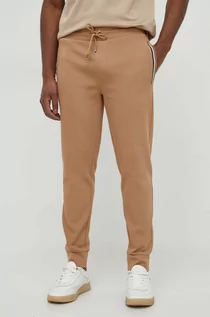 Spodnie męskie - BOSS spodnie dresowe kolor beżowy gładkie - Boss - grafika 1