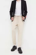 Spodnie męskie - HUGO spodnie dresowe bawełniane kolor beżowy gładkie - Hugo - miniaturka - grafika 1