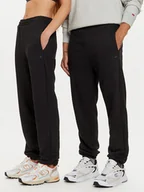 Spodnie sportowe męskie - 4F Spodnie dresowe Unisex 4FWAW24TTROU0826 Czarny Loose Fit - miniaturka - grafika 1