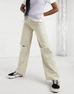 Spodnie damskie - Damskie Jeansy Beżowe Z Dziurami Dzwony 32 Asz - miniaturka - grafika 1