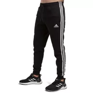 Spodnie sportowe męskie - Spodnie dresowe adidas Essentials 3-Stripes Fleece GM1089 - czarne - Adidas - miniaturka - grafika 1