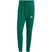 Dresy męskie - Spodnie męskie adidas Essentials French Terry Tapered Cuff 3-Stripes zielon - miniaturka - grafika 1