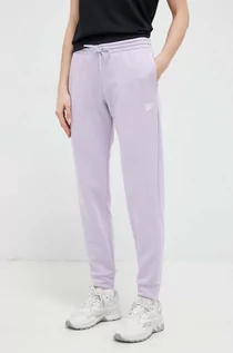 Spodnie damskie - Reebok spodnie dresowe kolor fioletowy gładkie - grafika 1