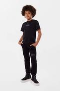 Spodnie i spodenki dla dziewczynek - Dkny spodnie dresowe bawełniane dziecięce kolor czarny z nadrukiem - DKNY - miniaturka - grafika 1