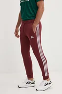 Spodnie męskie - adidas spodnie dresowe Essentials kolor bordowy z aplikacją JG5951 - miniaturka - grafika 1