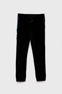 Spodnie damskie - Tommy Hilfiger Spodnie dziecięce kolor czarny gładkie - grafika 1