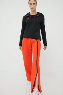 Spodnie damskie - Adidas by Stella McCartney by Stella McCartney spodnie dresowe damskie kolor pomarańczowy z nadrukiem - grafika 1