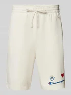 Spodnie sportowe męskie - Szorty z dzianiny dresowej kroju regular fit z nadrukiem z motywem - miniaturka - grafika 1