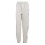 Spodnie rowerowe - adidas Kobiety Train Essentials 3-Stripes Woven Pants, wonder alumina/white, L Tall - miniaturka - grafika 1