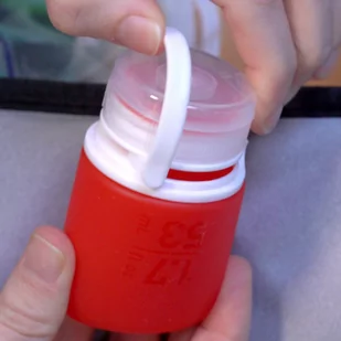 Zestaw 3 butelek podróżnych na płyny Humangear GoToob+ S - clear / red / orange - Butelki dla niemowląt - miniaturka - grafika 4