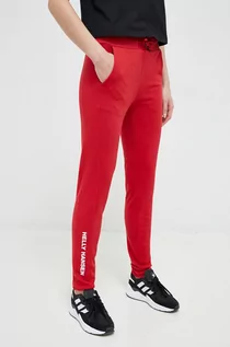 Spodnie damskie - Helly Hansen spodnie dresowe kolor czerwony gładkie - grafika 1