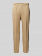 Spodnie sportowe męskie - Spodnie dresowe o kroju slim fit z naszywką z logo - miniaturka - grafika 1