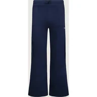 Spodnie i spodenki dla dziewczynek - Guess Spodnie dresowe flare fit - miniaturka - grafika 1