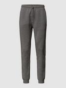 Spodnie sportowe męskie - Spodnie dresowe z nadrukiem w kontrastowym kolorze model ‘Hadiko’ - miniaturka - grafika 1