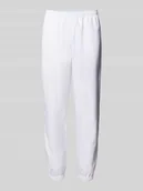 Spodnie sportowe męskie - Spodnie treningowe o kroju relaxed fit z naszywką z logo - miniaturka - grafika 1