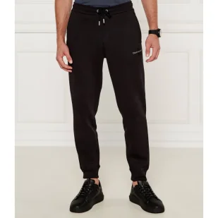 CALVIN KLEIN JEANS Spodnie dresowe | Regular Fit - Dresy męskie - miniaturka - grafika 1