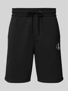 Spodnie sportowe męskie - Szorty z dzianiny dresowej z nadrukiem z logo - grafika 1
