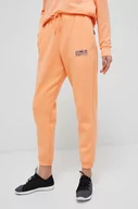 Spodnie damskie - Under Armour spodnie dresowe kolor pomarańczowy gładkie - miniaturka - grafika 1