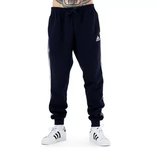 Spodnie adidas Essentials Fleece Fitted 3 Stripes GM1090 - granatowe - Spodnie sportowe męskie - miniaturka - grafika 1