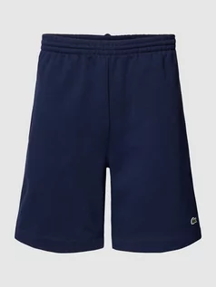 Spodnie sportowe męskie - Szorty z dzianiny dresowej z aplikacją z logo - grafika 1