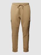Spodnie sportowe męskie - Spodnie dresowe z detalem z logo w jednolitym kolorze - miniaturka - grafika 1