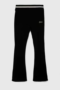 Spodnie i spodenki dla dziewczynek - Guess spodnie dresowe dziecięce kolor czarny gładkie - grafika 1