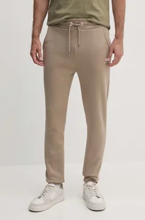 Alpha Industries spodnie dresowe kolor beżowy gładkie - Spodnie męskie - miniaturka - grafika 1