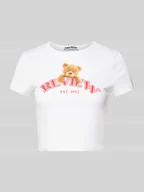 Koszulki i topy damskie - T-shirt krótki z nadrukiem z motywem i logo - miniaturka - grafika 1