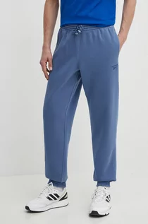 Spodnie męskie - Reebok spodnie dresowe kolor niebieski gładkie 100075631 - grafika 1