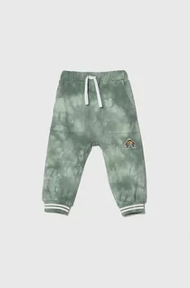 Spodnie i spodenki dla chłopców - United Colors of Benetton spodnie dresowe bawełniane dziecięce kolor zielony wzorzyste - grafika 1