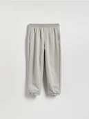 Spodnie i spodenki dla chłopców - Reserved - Bawełniane spodnie jogger - jasnoszary - miniaturka - grafika 1