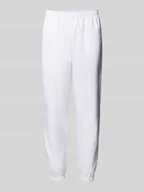 Spodnie sportowe męskie - Spodnie treningowe o kroju relaxed fit z naszywką z logo - miniaturka - grafika 1