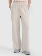 Spodnie sportowe damskie - 4F Spodnie dresowe w kolorze szarobrązowym - miniaturka - grafika 1