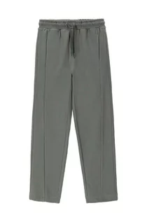Spodnie i spodenki dla chłopców - Coccodrillo spodnie dresowe bawełniane dziecięce kolor zielony gładkie - grafika 1