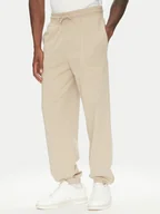 Spodnie sportowe męskie - Guess Spodnie dresowe U5RB00 KCO31 Beżowy Regular Fit - miniaturka - grafika 1