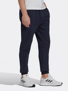 Adidas Spodnie dresowe "Feelcozy" w kolorze granatowym - Spodnie sportowe męskie - miniaturka - grafika 1