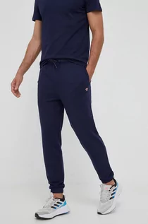 Spodnie męskie - Hummel spodnie dresowe bawełniane kolor granatowy z aplikacją - grafika 1